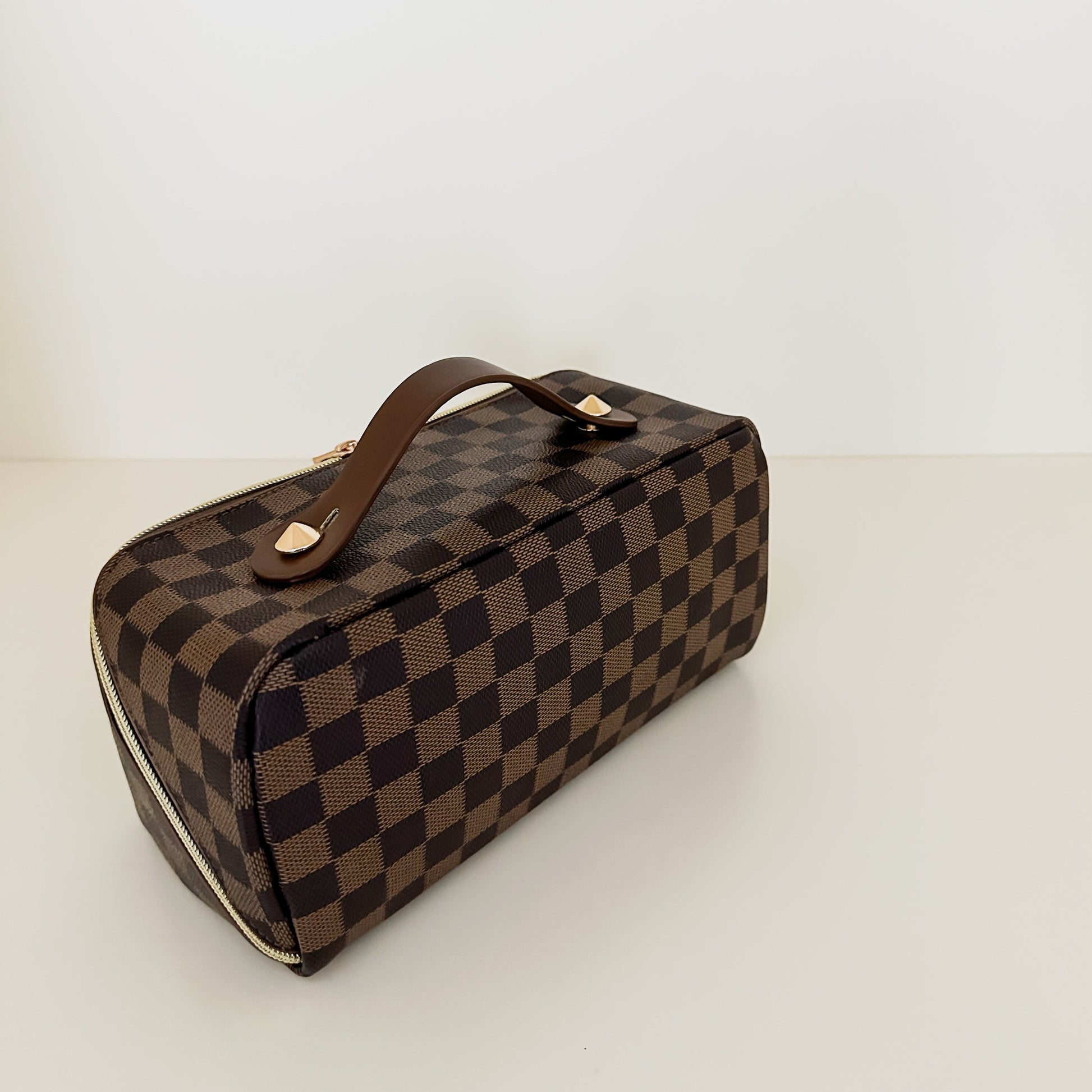 Brown checkered toiletry case back view