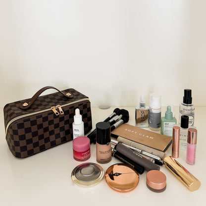 Brown checkered toiletry case holds makeup, skincare, perfume and more