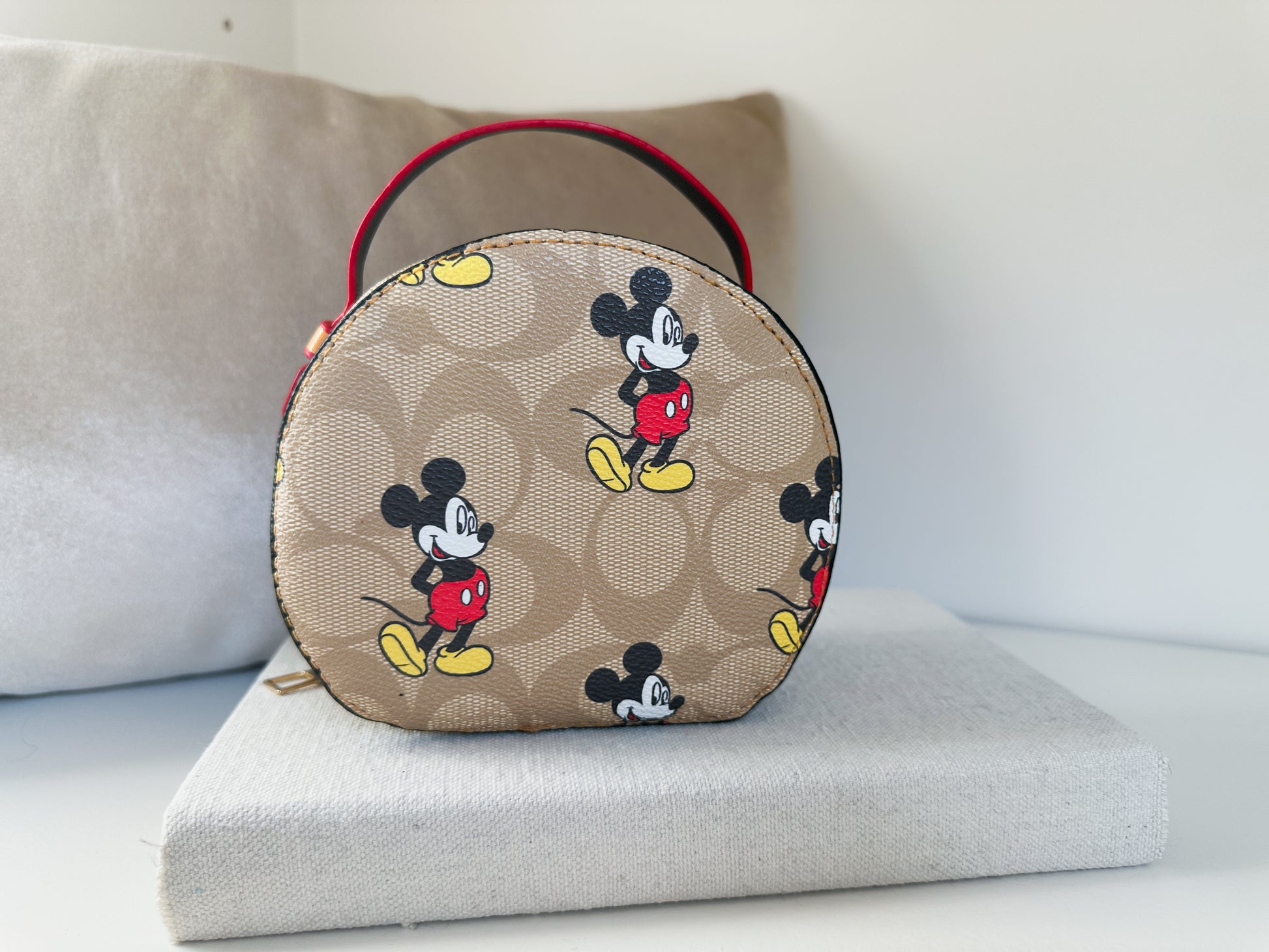 Round mini purse with C print and cartoon graphic back view | the epcot by little luxe