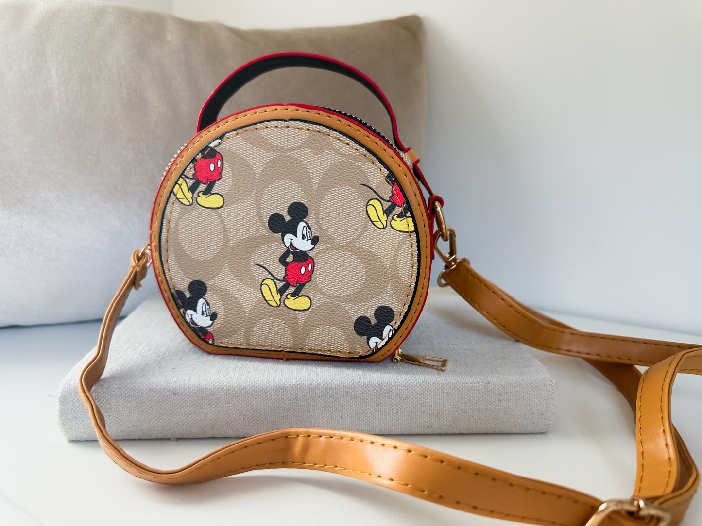 Round mini zippered purse with C print and cartoon graphic with crossbody strap | the epcot by little luxe