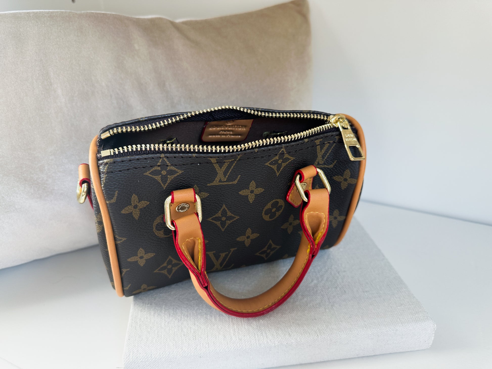 Iconic luxury print mini handbag open zipper | the boston by little luxe